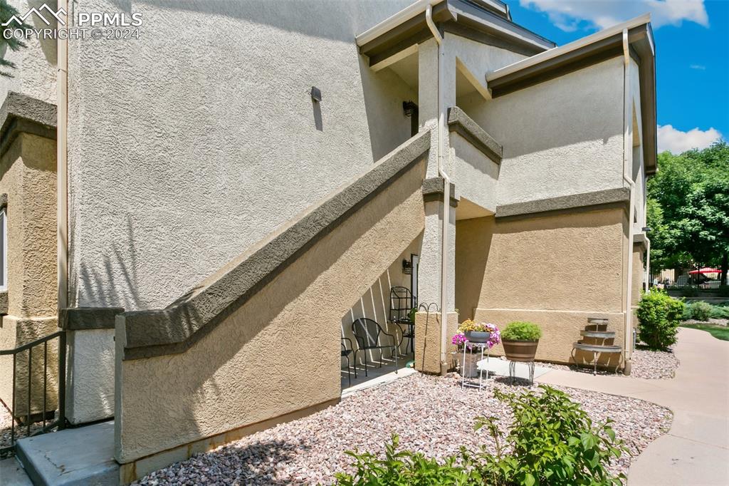 3831 Riviera Grove, Unit 204 Colorado Springs, CO 80922 - Photo 2 of 35 a view of stairs and patio