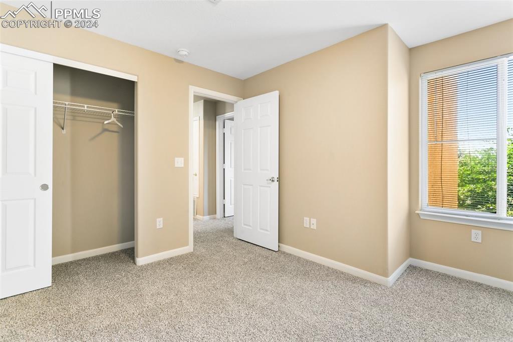 3831 Riviera Grove, Unit 204 Colorado Springs, CO 80922 - Photo 24 of 35 an empty room with windows and closet