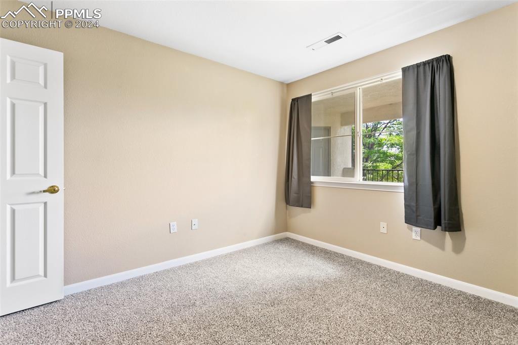 3831 Riviera Grove, Unit 204 Colorado Springs, CO 80922 - Photo 28 of 35 an empty room with windows