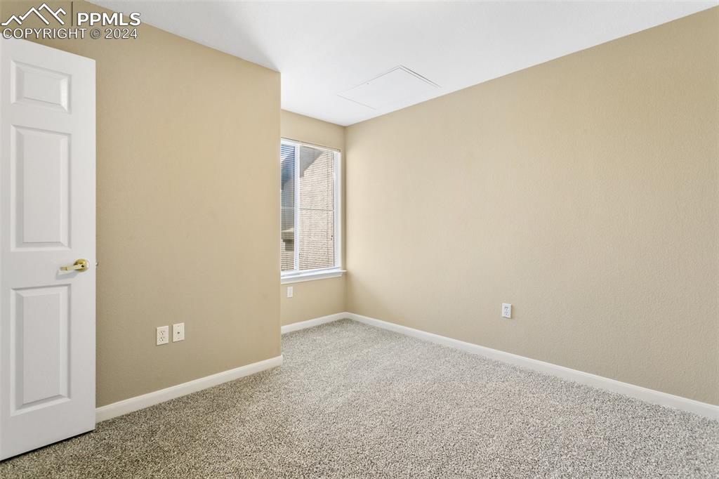 3831 Riviera Grove, Unit 204 Colorado Springs, CO 80922 - Photo 30 of 35 an empty room with windows