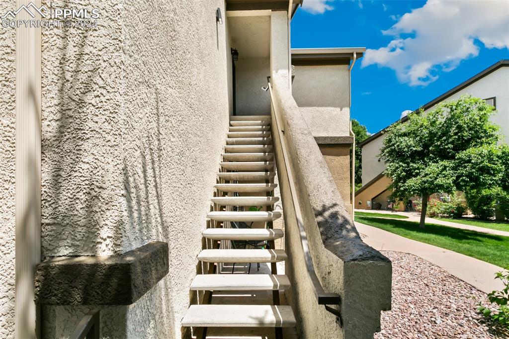 3831 Riviera Grove, Unit 204 Colorado Springs, CO 80922 - Photo 3 of 35 a view of building with yard