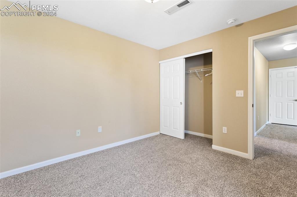 3831 Riviera Grove, Unit 204 Colorado Springs, CO 80922 - Photo 31 of 35 an empty room with closet area