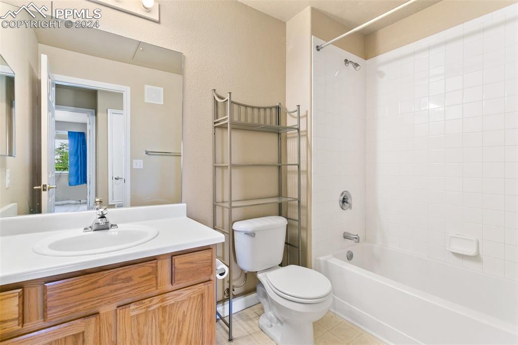 3831 Riviera Grove, Unit 204 Colorado Springs, CO 80922 - Photo 32 of 35 a bathroom with a sink toilet and shower