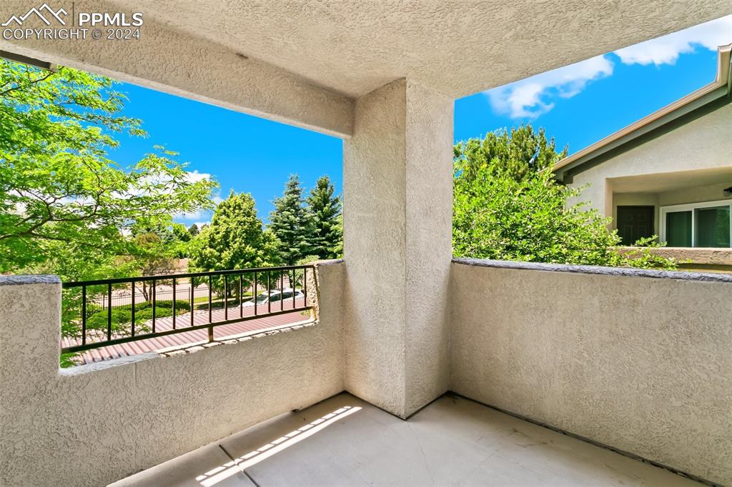 3831 Riviera Grove, Unit 204 Colorado Springs, CO 80922 - Photo 34 of 35 a view of a building from a balcony