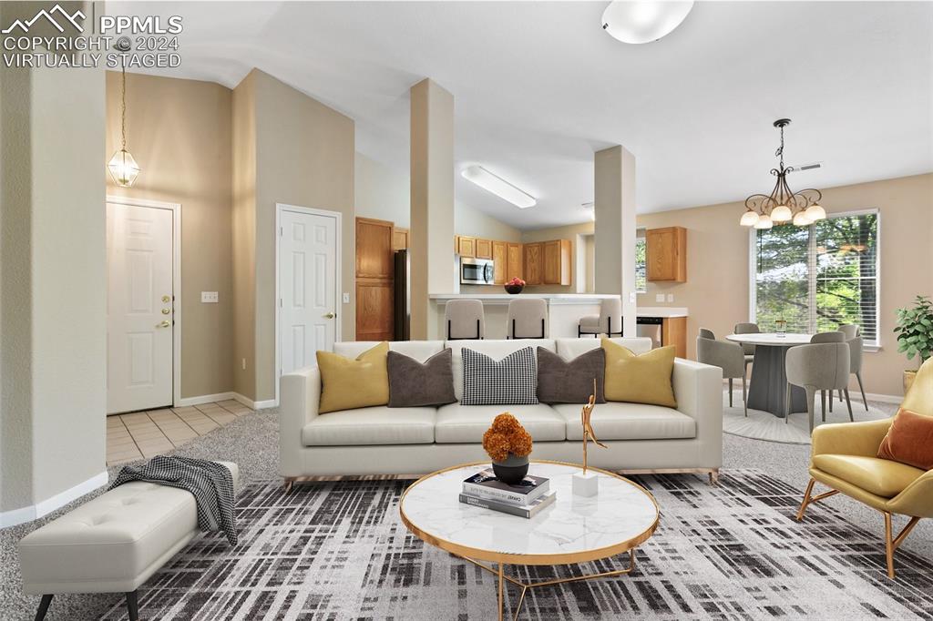 3831 Riviera Grove, Unit 204 Colorado Springs, CO 80922 - Photo 4 of 35 a living room with furniture and a large window