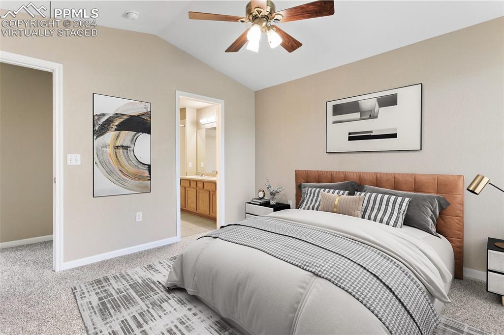 3831 Riviera Grove, Unit 204 Colorado Springs, CO 80922 - Photo 10 of 35 a bedroom with a bed and a painting on the wall