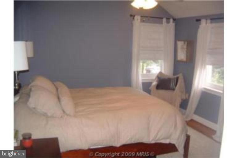 313 Marvin Road Silver Spring, MD 20901 - Photo 12 of 20 Master bedroom w/ceiling fan & hardwood flooring.