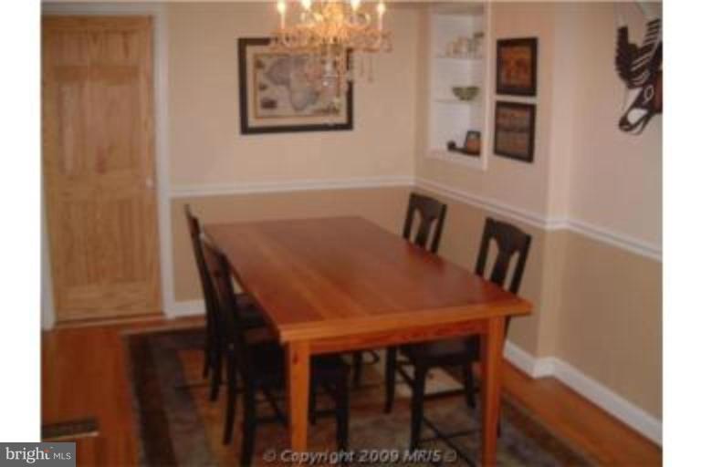 313 Marvin Road Silver Spring, MD 20901 - Photo 8 of 20 Oversized separate dining room w/chair railing.