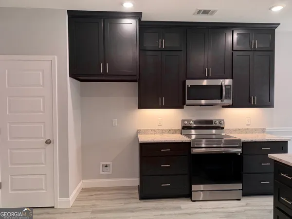 a kitchen with a sink and a stove