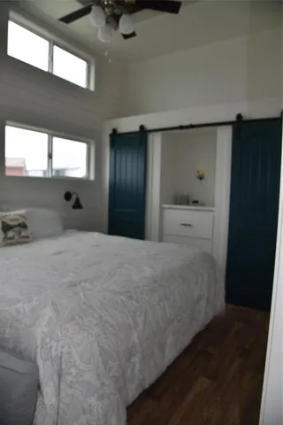 a bedroom with a large bed and a window