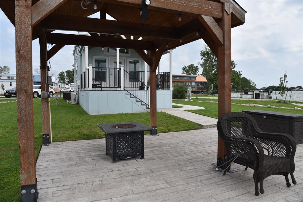 6465 Peninsula Road Kerens, TX 75144 - Photo 18 of 34 a view of a porch with furniture and garden