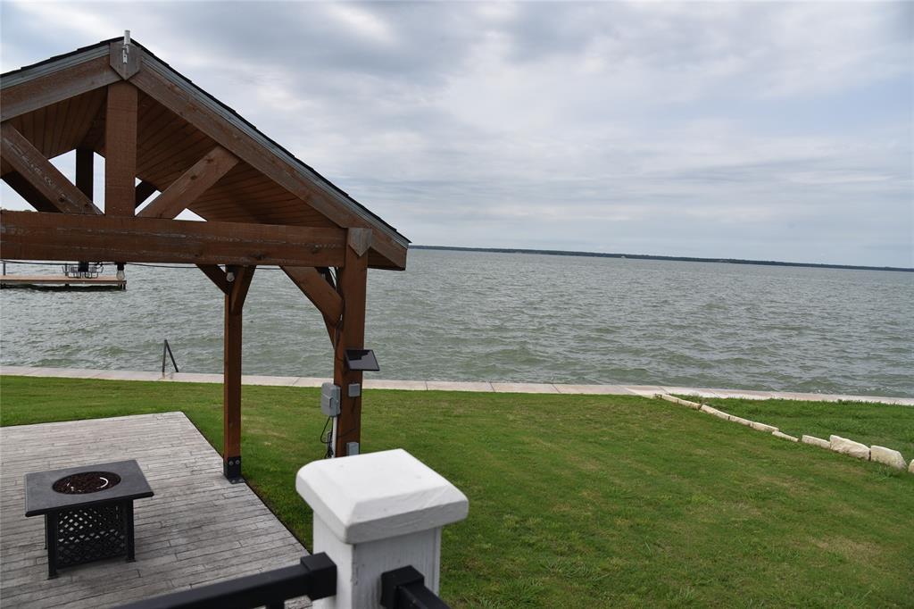 6465 Peninsula Road Kerens, TX 75144 - Photo 20 of 34 a view of a backyard with sitting area