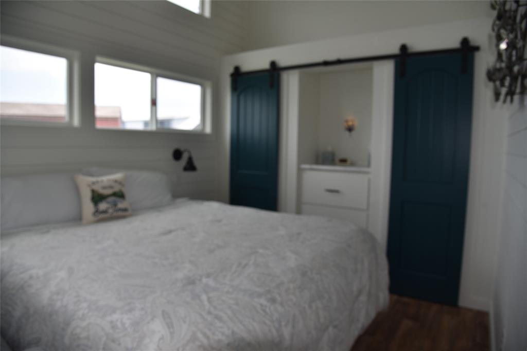 6465 Peninsula Road Kerens, TX 75144 - Photo 10 of 34 a bedroom with a bed and a dresser
