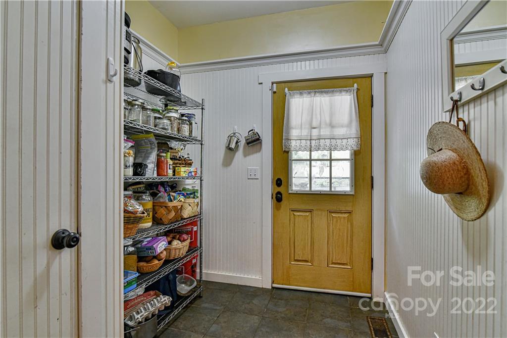 157 Poverty Branch Road Barnardsville, NC 28709 - Photo 16 of 48 a view of walk in closet with clothes and shoes