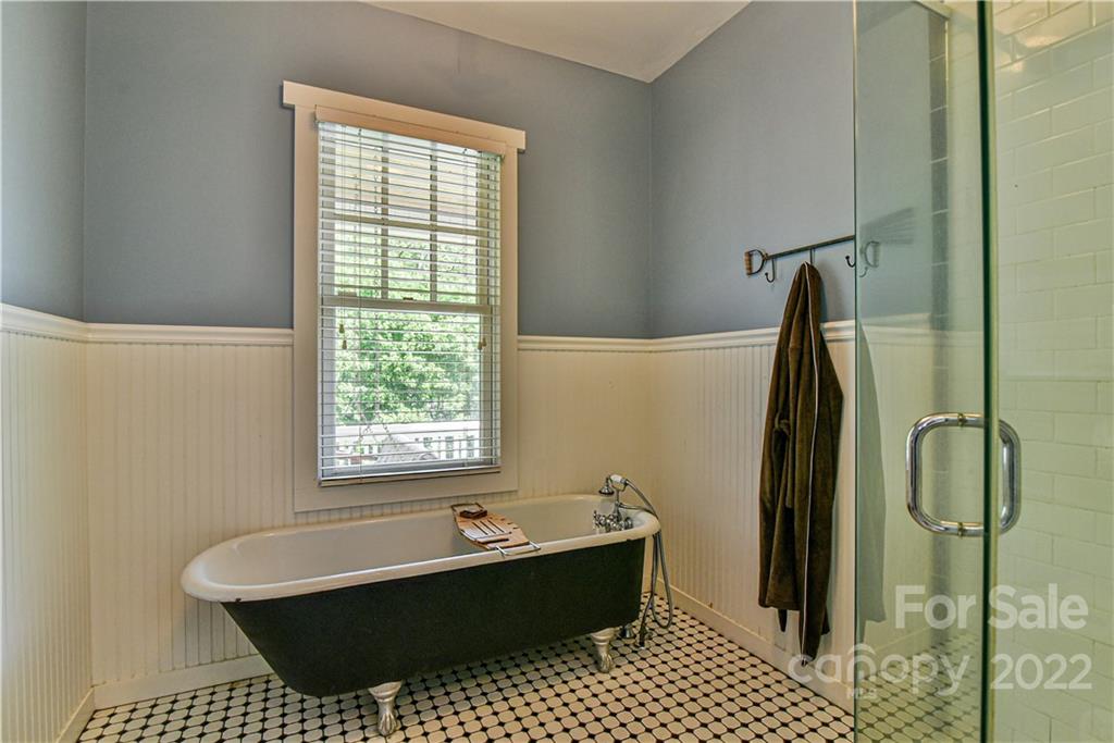 157 Poverty Branch Road Barnardsville, NC 28709 - Photo 23 of 48 a bathroom with a bathtub sink and shower