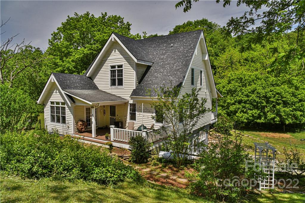 157 Poverty Branch Road Barnardsville, NC 28709 - Photo 3 of 48 an aerial view of a house with a yard and potted plants