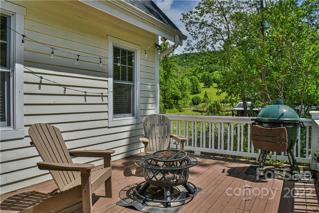 157 Poverty Branch Road Barnardsville, NC 28709 - Photo 37 of 48 a view of a chair and table on the deck