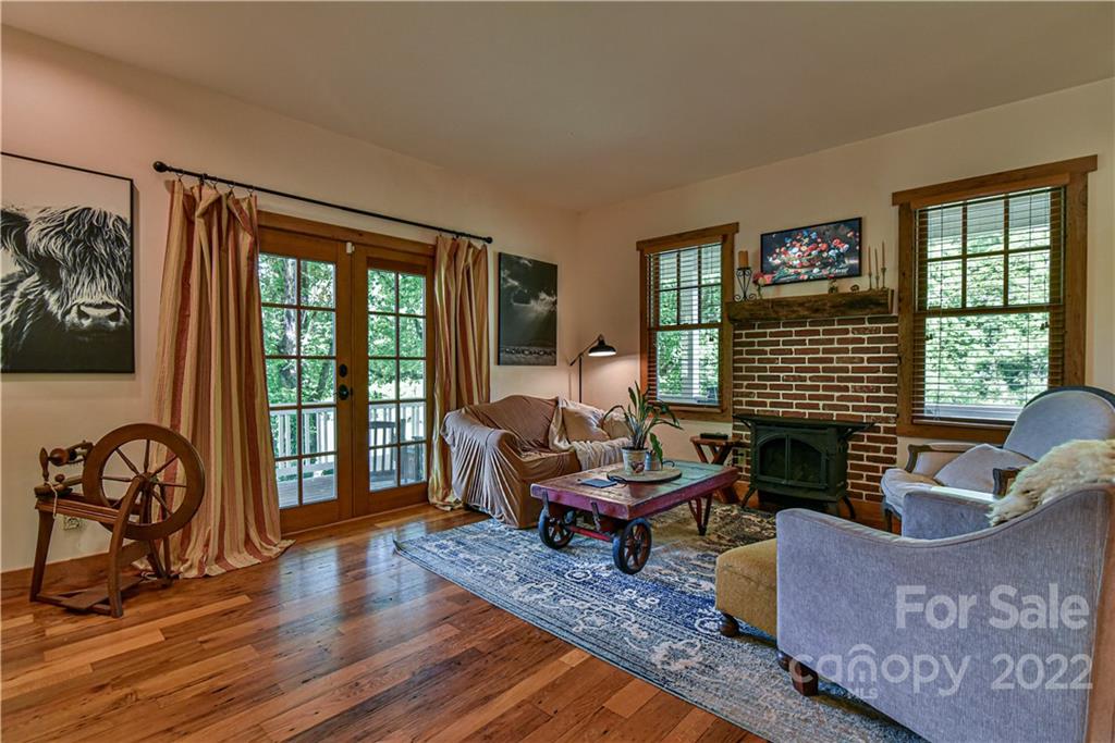157 Poverty Branch Road Barnardsville, NC 28709 - Photo 9 of 48 a living room with furniture and a window