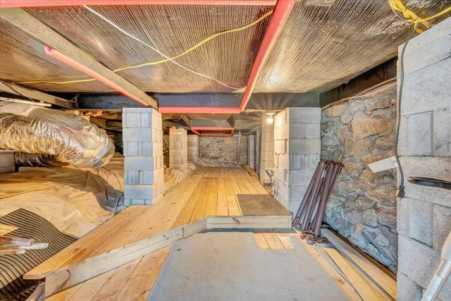 a view of a lake with table and chairs