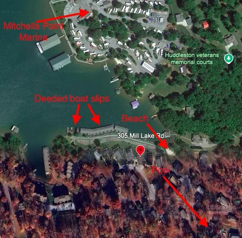 a view of a roof deck with table and chairs a barbeque with wooden floor and fence