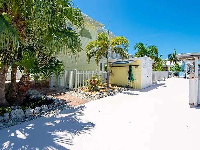 11563 4th Ave Ocean Marathon, FL 33050 - Photo 13 of 15 a view of a house with a yard and plant