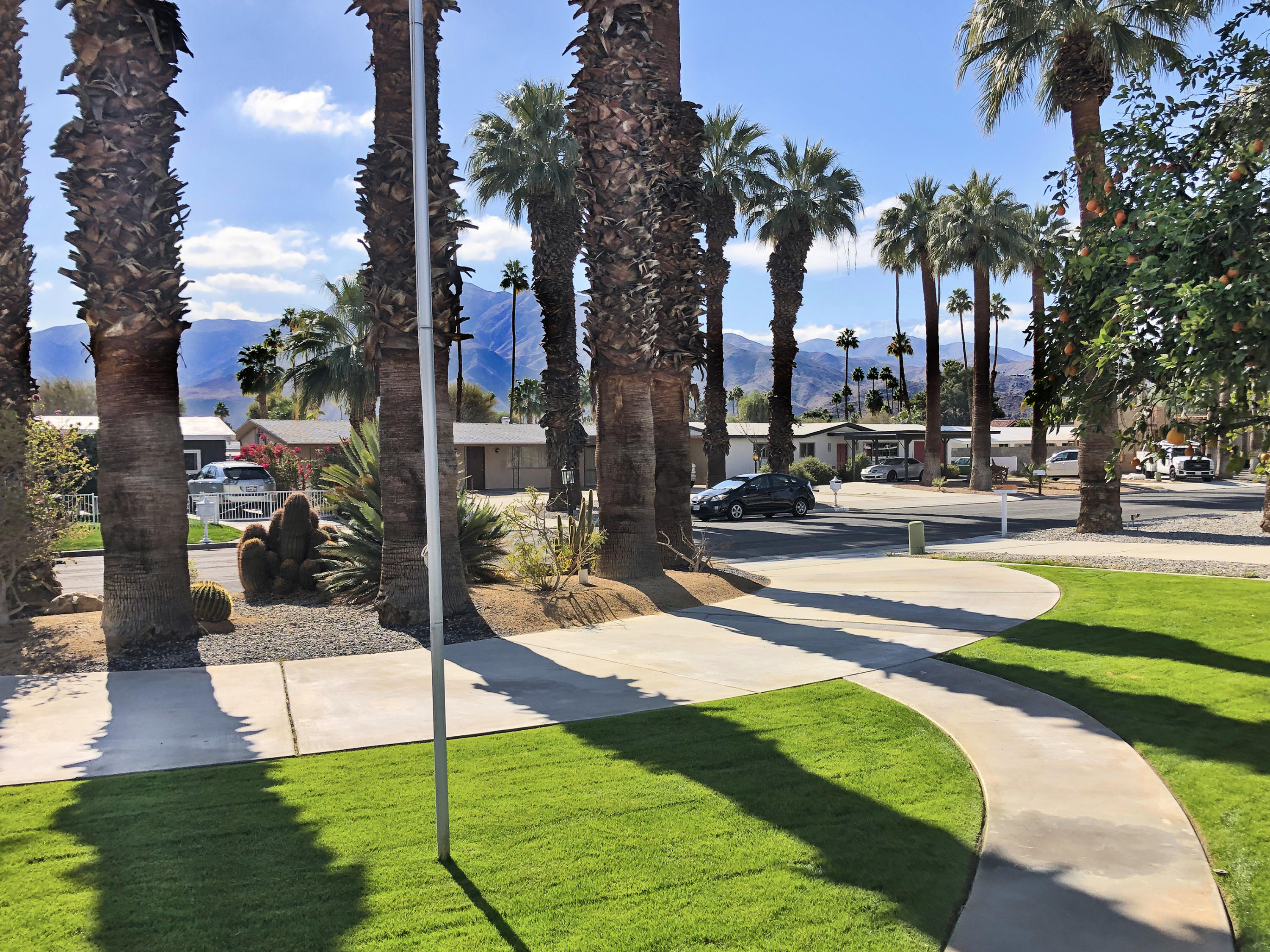 70090 Chappel Road Rancho Mirage, CA 92270 - Photo 2 of 26 a view of a swimming pool with a patio