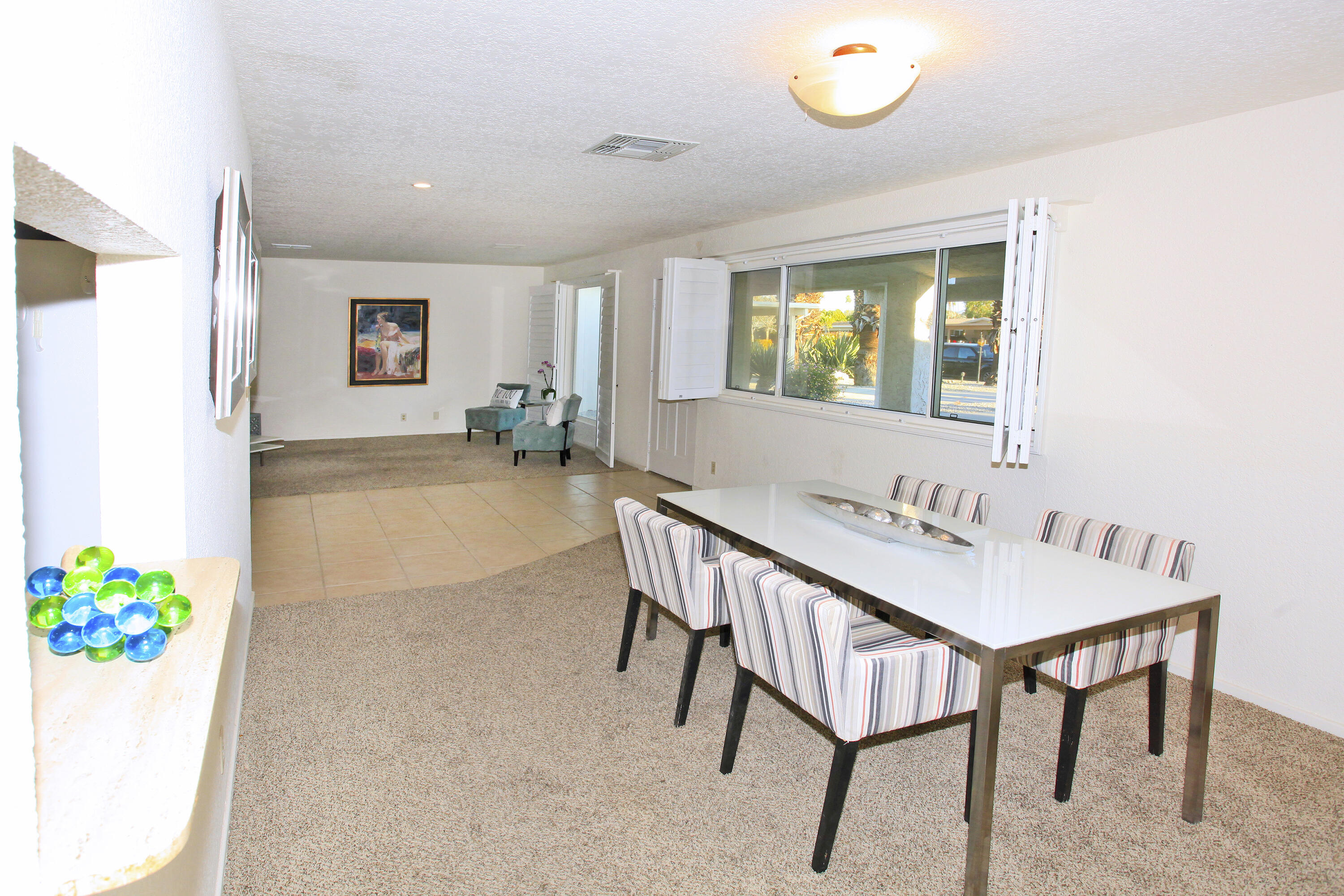 70090 Chappel Road Rancho Mirage, CA 92270 - Photo 12 of 26 a view of a dining room with furniture and a potted plant