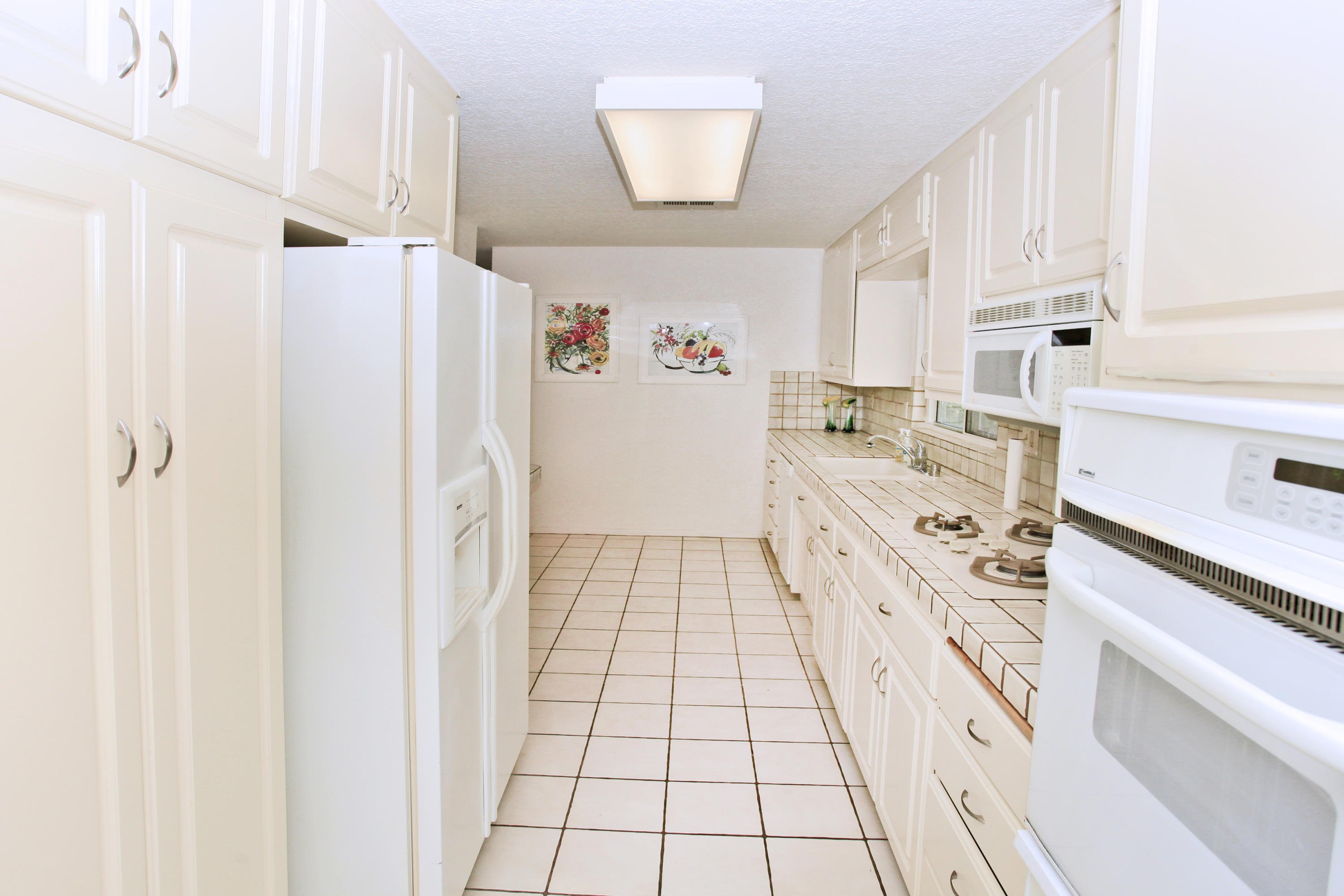 70090 Chappel Road Rancho Mirage, CA 92270 - Photo 13 of 26 a kitchen with stainless steel appliances a refrigerator and a stove
