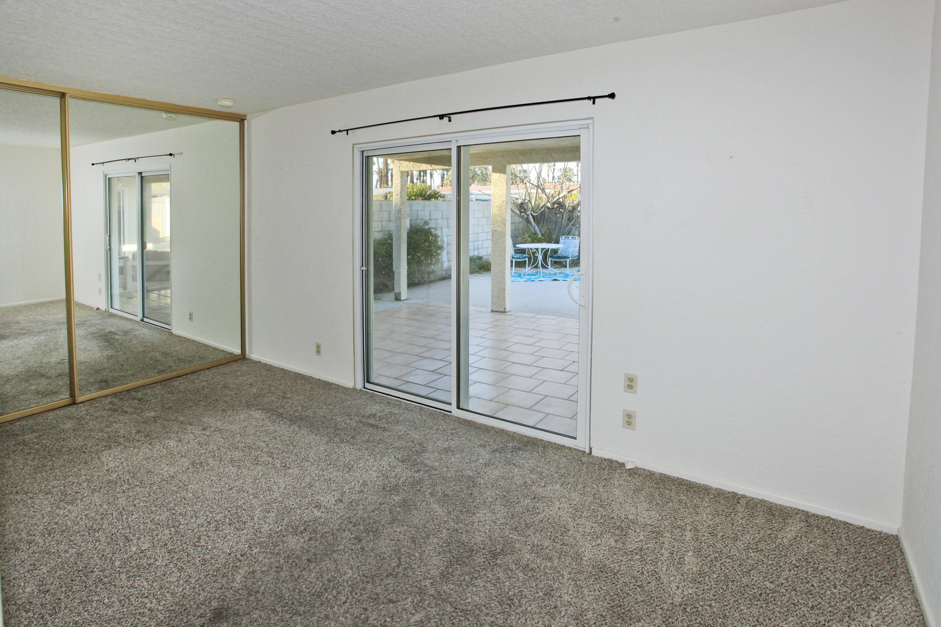 70090 Chappel Road Rancho Mirage, CA 92270 - Photo 19 of 26 an empty room with sliding glass door
