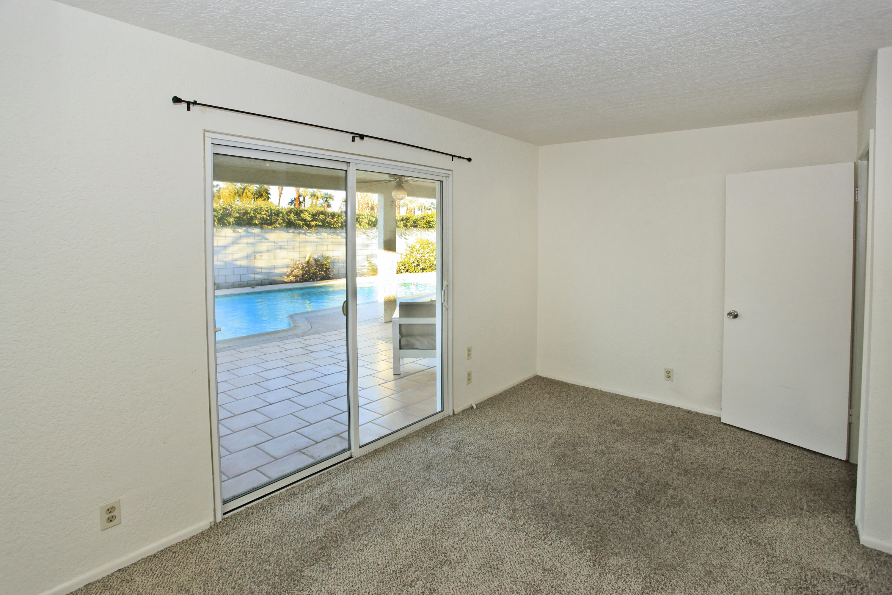 70090 Chappel Road Rancho Mirage, CA 92270 - Photo 20 of 26 an empty room with sliding door