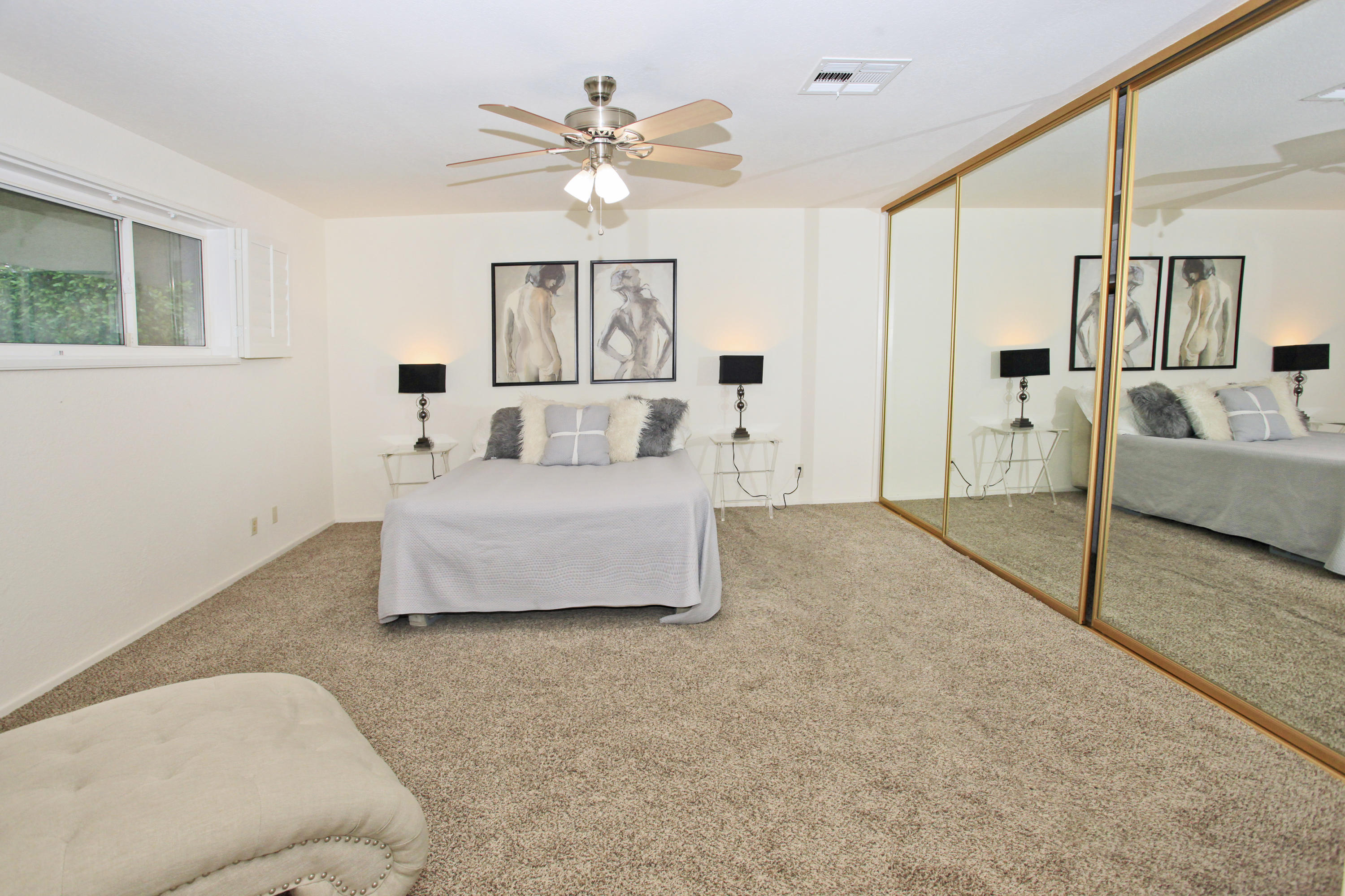 70090 Chappel Road Rancho Mirage, CA 92270 - Photo 8 of 26 a living room with furniture and a chandelier