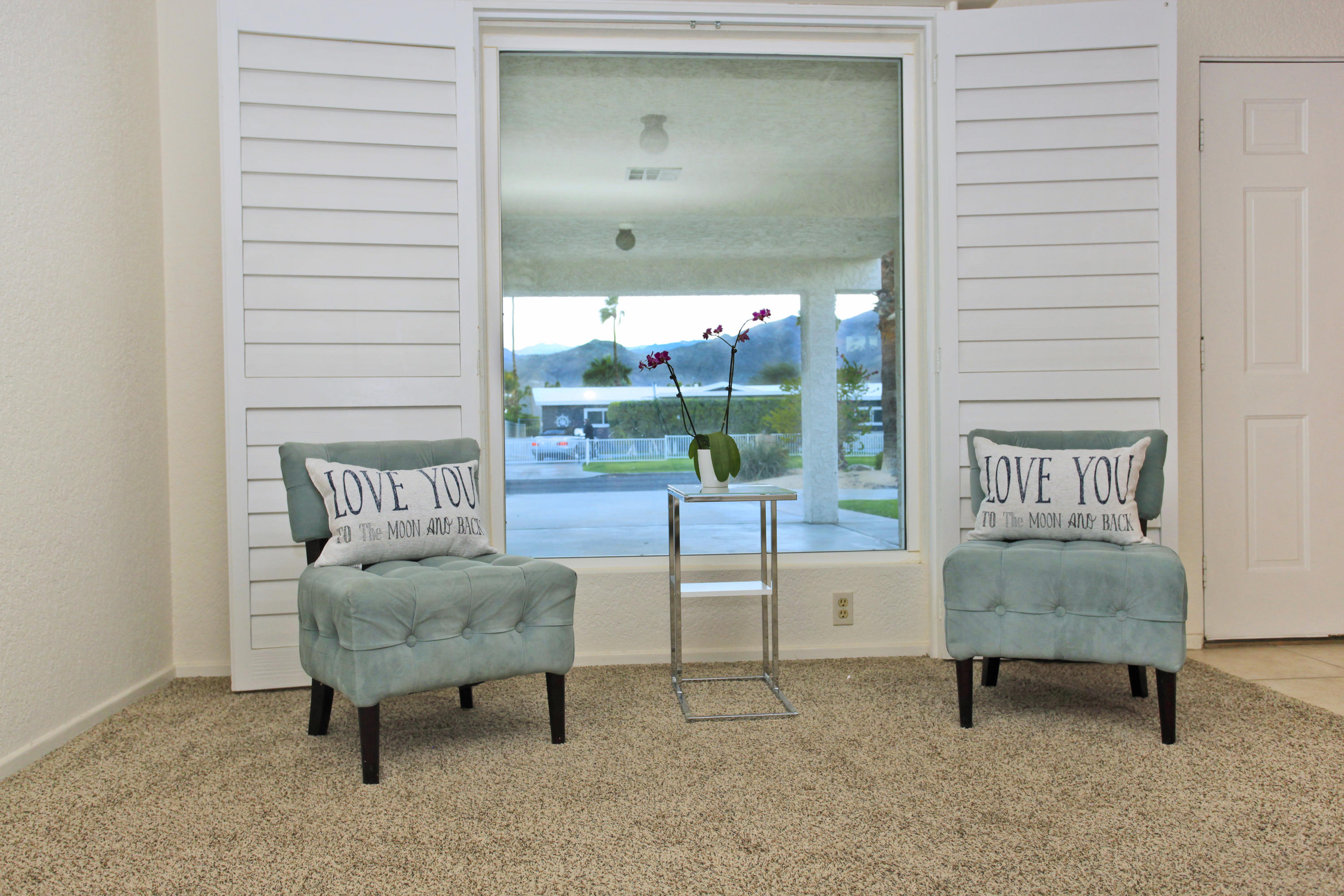 70090 Chappel Road Rancho Mirage, CA 92270 - Photo 9 of 26 a living room with furniture and a gate