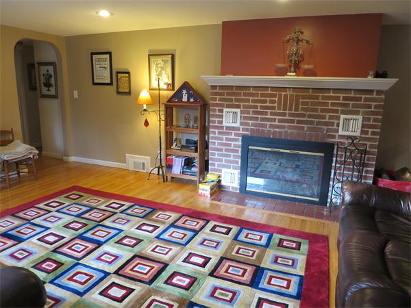 3096 Boston Road Wilbraham, MA 01095 - Photo 13 of 18 a living room with a rug and a fireplace