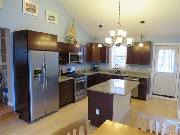 3096 Boston Road Wilbraham, MA 01095 - Photo 2 of 18 a kitchen with stainless steel appliances granite countertop a refrigerator a stove a sink and a microwave