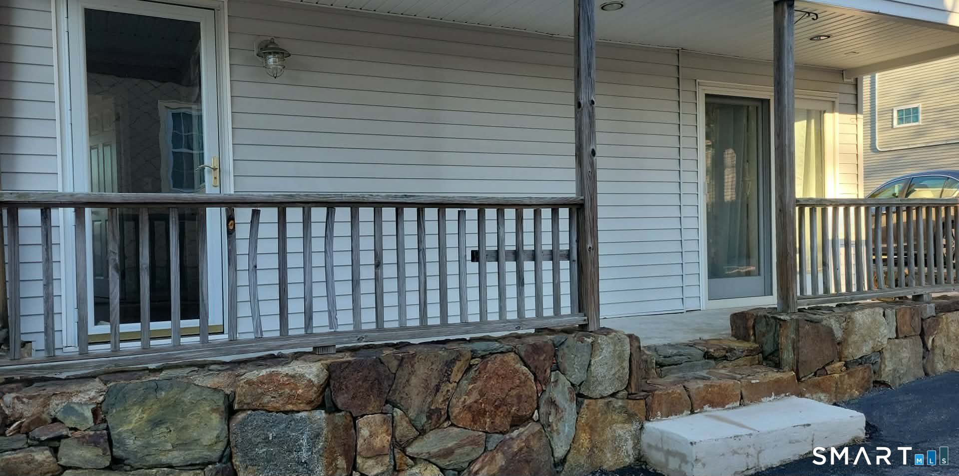 26 King Street Shelton, CT 06484 - Photo 12 of 15 a view of a chair and table in the balcony