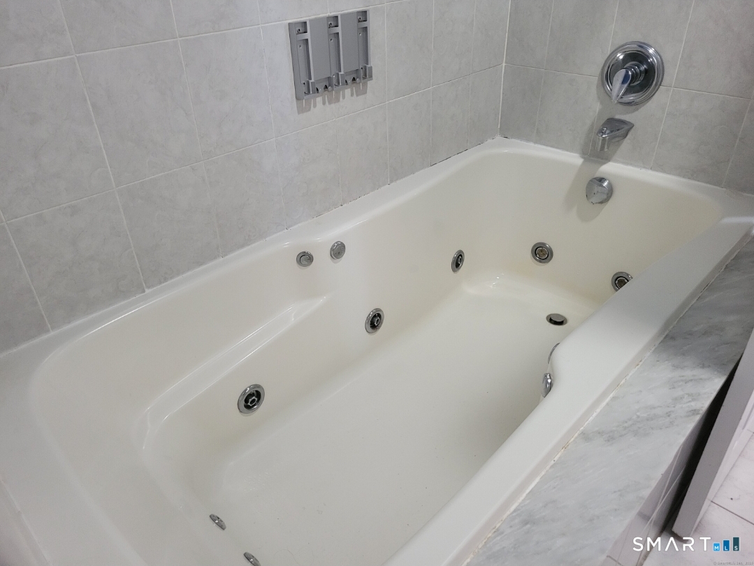 26 King Street Shelton, CT 06484 - Photo 6 of 15 a bathroom with a tub and a shower