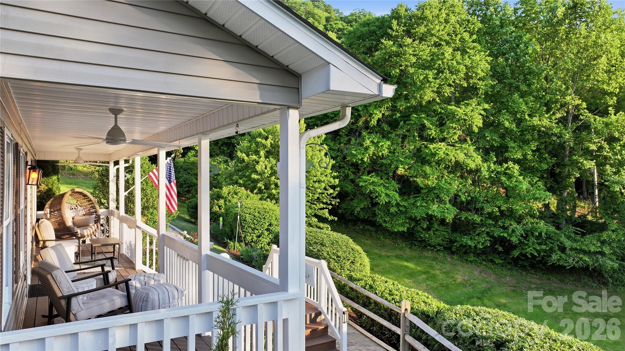15 Raccoon Point Canton, NC 28716 - Photo 7 of 48 a view of a porch with furniture and garden