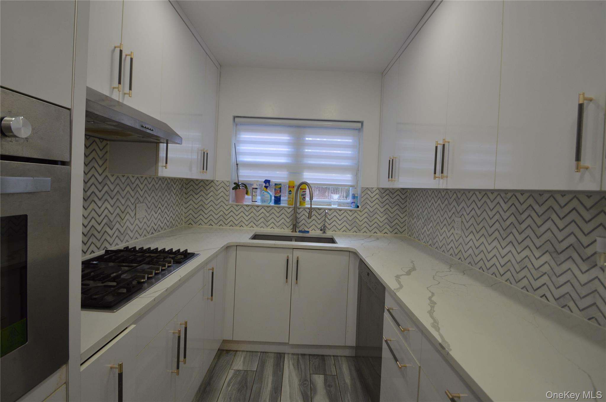 a kitchen with a sink and cabinets