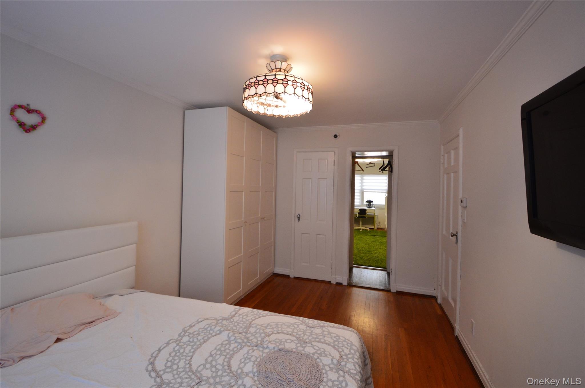 105-46 65th Road Queens, NY 11375 - Photo 14 of 20 a view of an empty room with a window