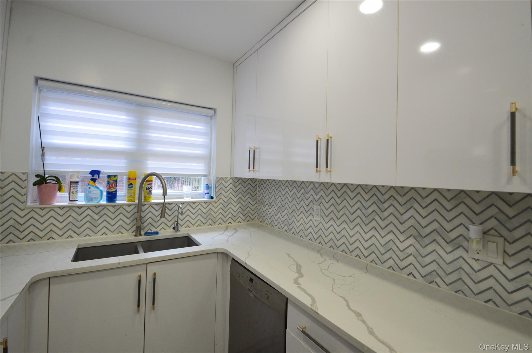 105-46 65th Road Queens, NY 11375 - Photo 3 of 20 a kitchen with a sink and a refrigerator