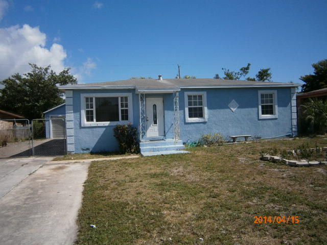 348 West 24th Street Riviera Beach, FL 33404 - Photo 1 of 9 front