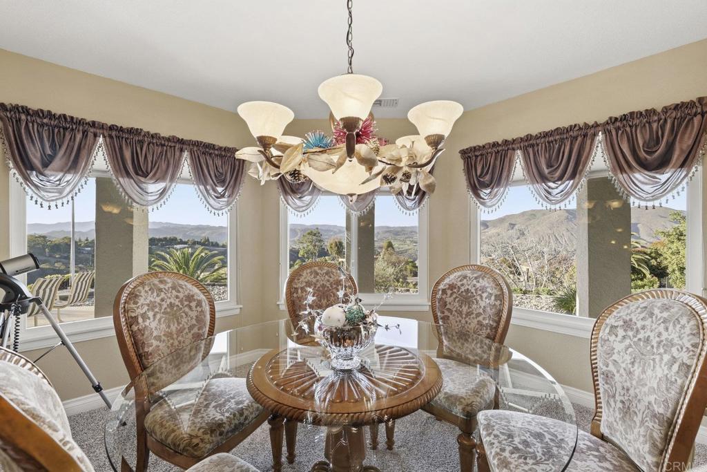 1524 Zutano Lane Fallbrook, CA 92028 - Photo 13 of 49 a view of a dining room with furniture and chandelier