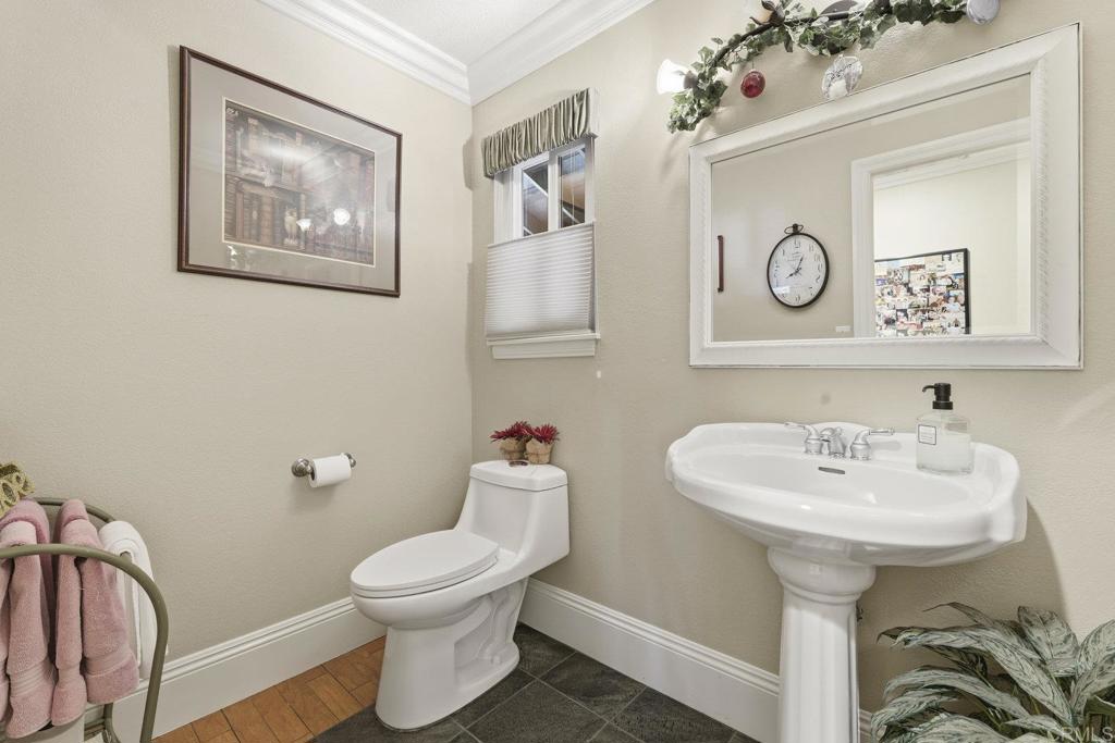 1524 Zutano Lane Fallbrook, CA 92028 - Photo 22 of 49 a bathroom with a toilet sink and mirror