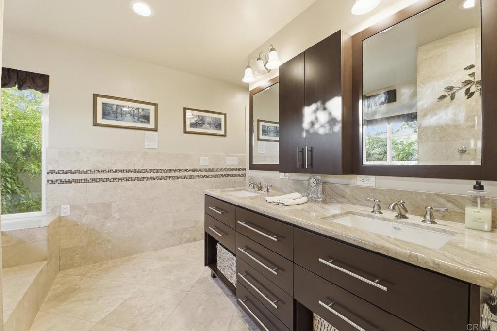 1524 Zutano Lane Fallbrook, CA 92028 - Photo 26 of 49 a bathroom with a granite countertop sink mirror and a