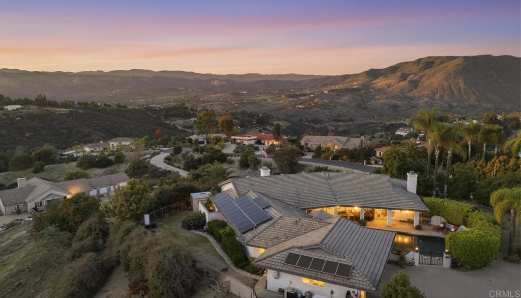 1524 Zutano Lane Fallbrook, CA 92028 - Photo 33 of 49 a view of a city with mountains in the background