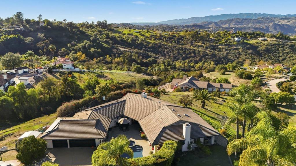 1524 Zutano Lane Fallbrook, CA 92028 - Photo 47 of 49 an aerial view of a house with a yard and lake view