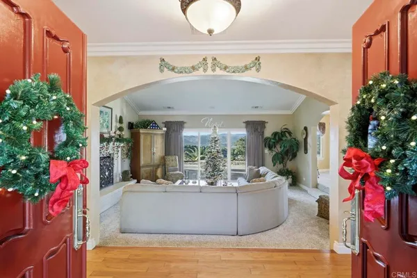 a view of living room with patio furniture and potted plants