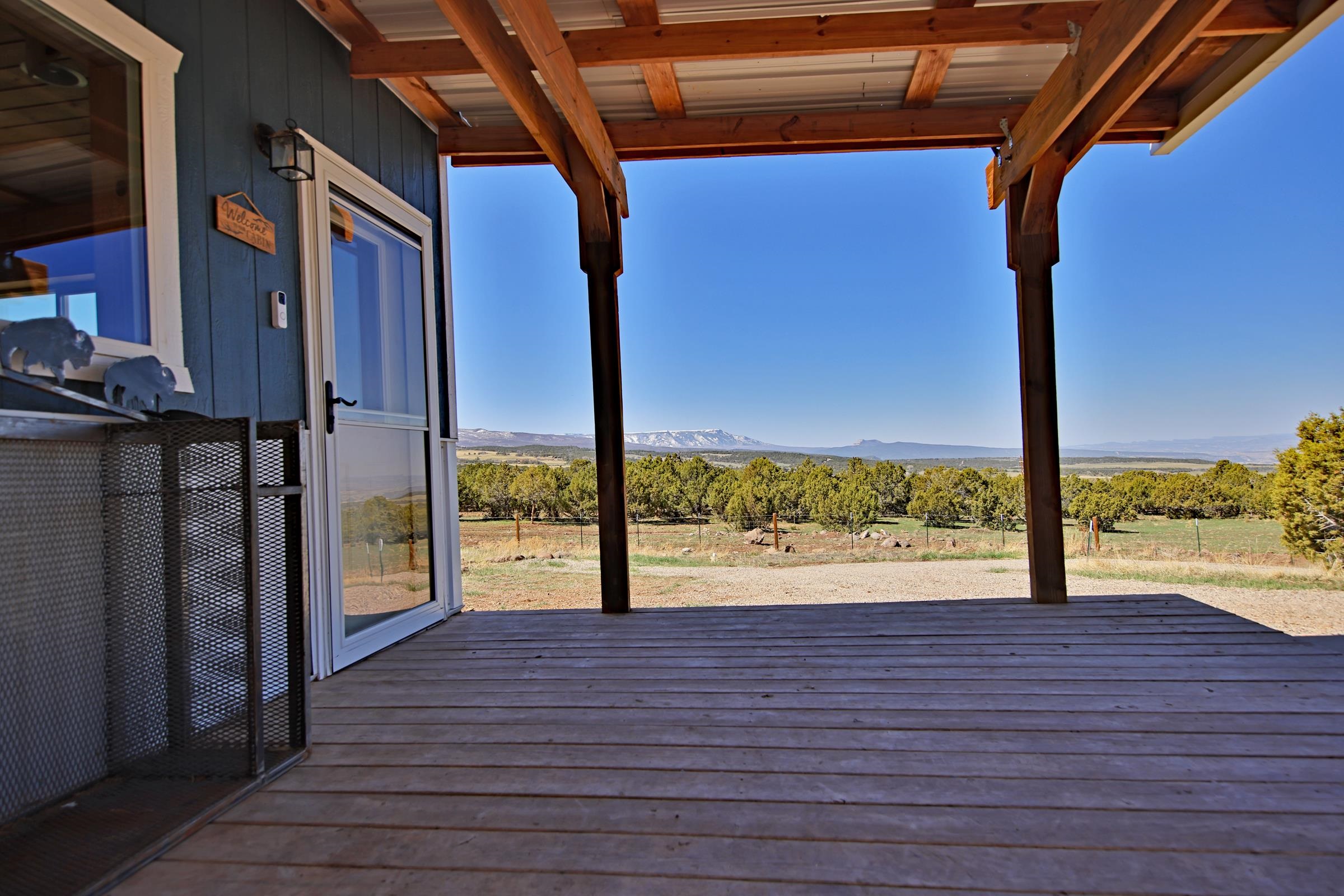56001 KK Road Molina, CO 81646 - Photo 8 of 42 a view of a room with wooden floor and floor to ceiling window