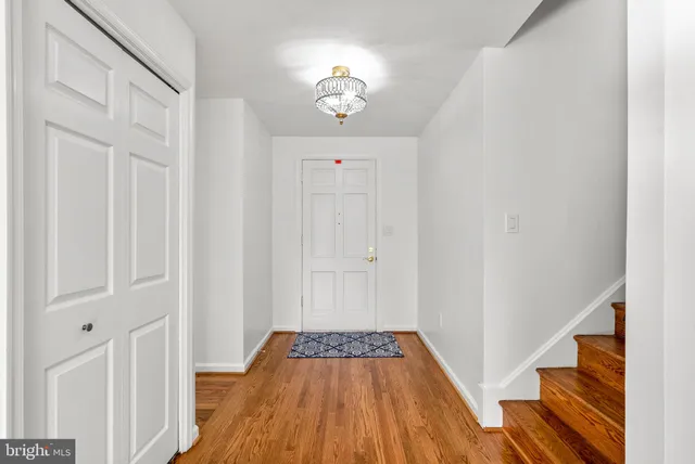 a view of an entryway with wooden floor