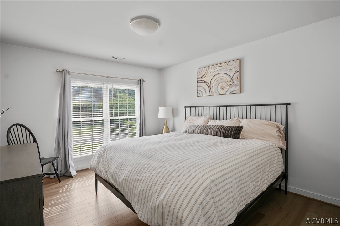 14012 Lenox Forest Court Midlothian, VA 23113 - Photo 32 of 49 a bedroom with a large bed and a window